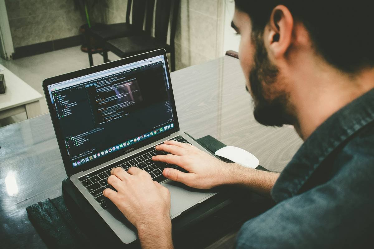 Bar chart showing developers using AI tools complete coding tasks 55% faster with 27% fewer bugs, based on Stanford 2023 study